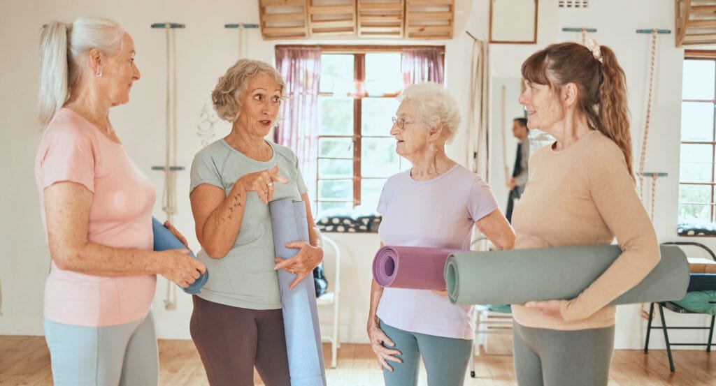 Personal trainer working with a senior at home in Milton