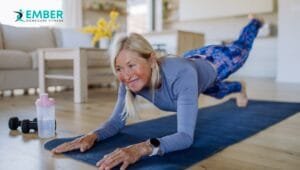 Personal trainer Mississauga helping senior with in-home exercises