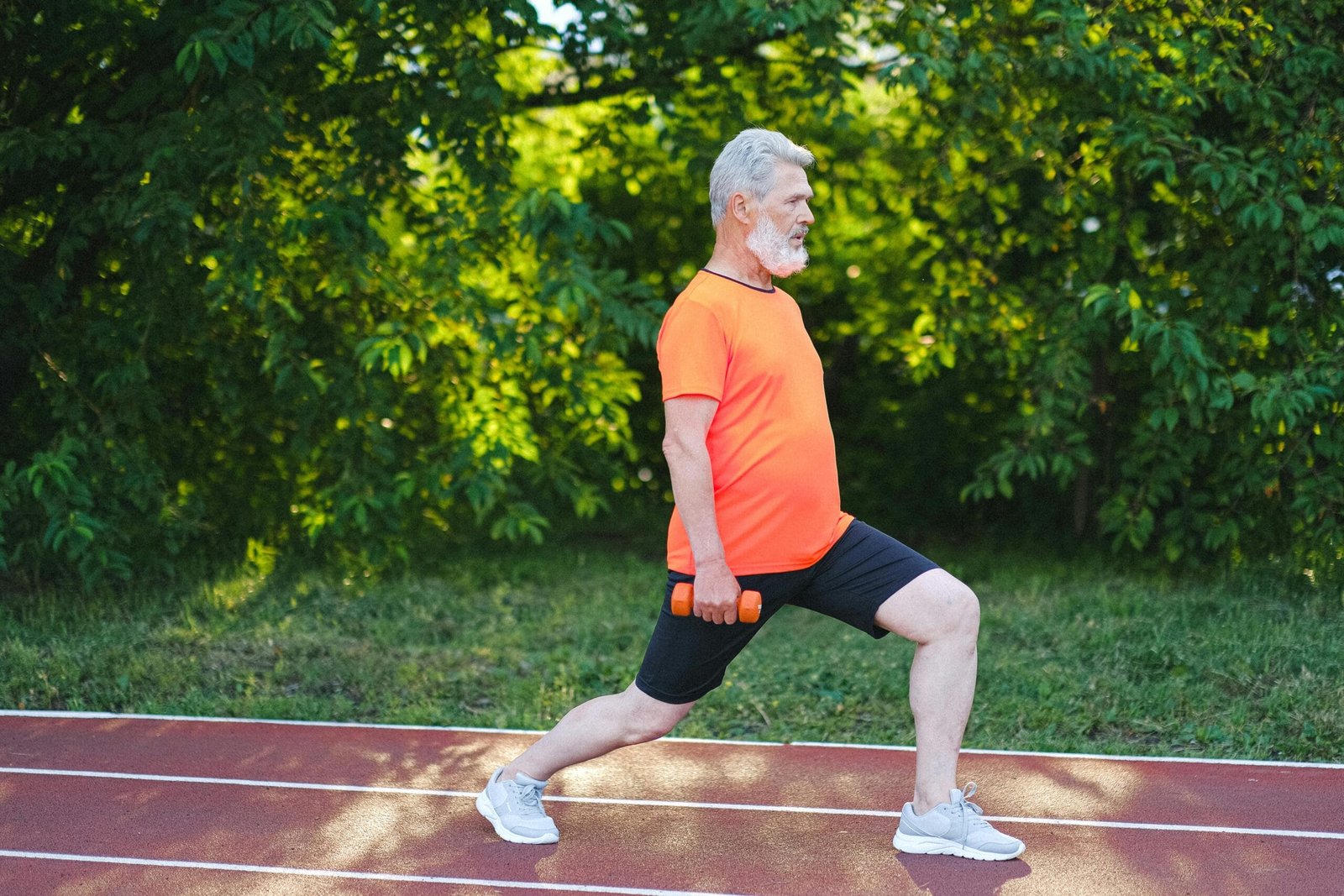 Essential Leg Strengthening Exercises for Seniors 1 Senior man doing leg exercises at home to improve strength, balance, and prevent falls